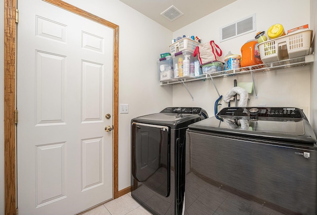 53029 Meadow View Ln, Paw Paw, MI 49079 - laundry area featuring separate washer and dryer and light tile patterned floors