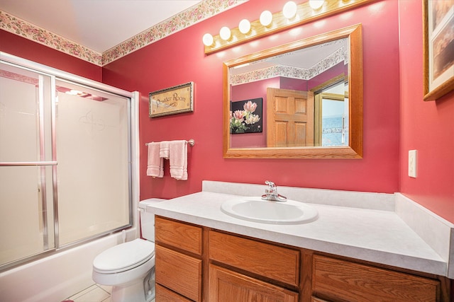 53029 Meadow View Ln, Paw Paw, MI 49079 - full bathroom with vanity, toilet, combined bath / shower with glass door, and tile patterned floors