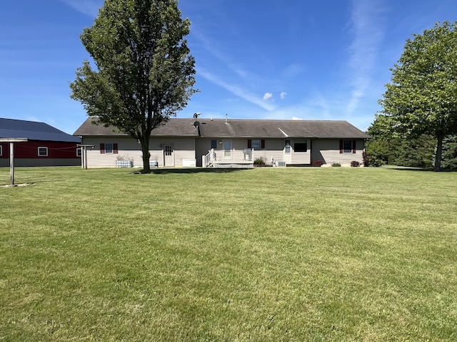 5781 S Waldron Rd, Pittsford, MI 49271 - back of house with a yard and a deck