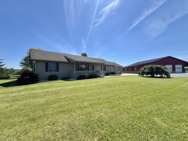 5781 S Waldron Rd, Pittsford, MI 49271 - ranch-style home featuring a porch, a front yard, and a detached garage