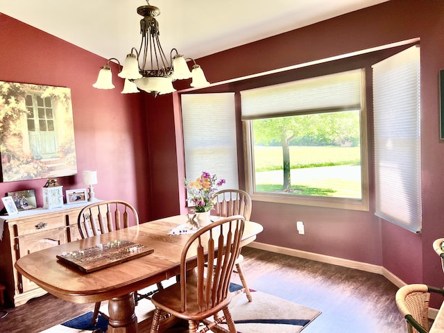 5781 S Waldron Rd, Pittsford, MI 49271 - dining room with a chandelier, wood finished floors, and baseboards