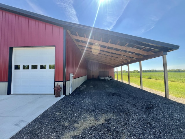 5781 S Waldron Rd, Pittsford, MI 49271 - view of parking with a garage, a rural view, and driveway