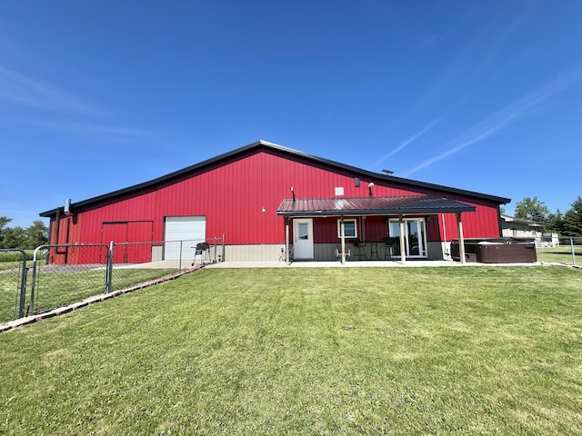 5781 S Waldron Rd, Pittsford, MI 49271 - back of house featuring a hot tub and a garage