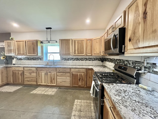 5781 S Waldron Rd, Pittsford, MI 49271 - kitchen featuring appliances with stainless steel finishes, a sink, decorative backsplash, and light stone countertops