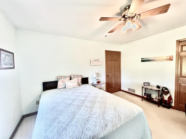 5781 S Waldron Rd, Pittsford, MI 49271 - bedroom with light carpet, baseboards, and a ceiling fan