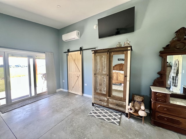 5781 S Waldron Rd, Pittsford, MI 49271 - bedroom with a wall mounted air conditioner, concrete floors, a barn door, and access to outside