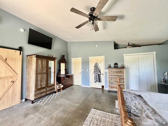 5781 S Waldron Rd, Pittsford, MI 49271 - bedroom featuring concrete floors, baseboards, lofted ceiling, a ceiling fan, and a barn door