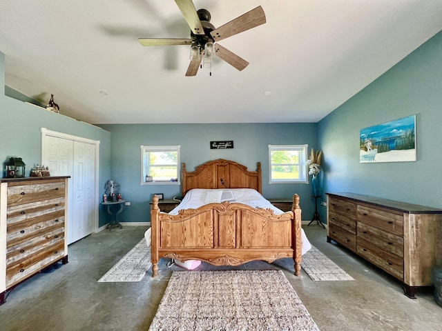 5781 S Waldron Rd, Pittsford, MI 49271 - bedroom with concrete flooring, multiple windows, a ceiling fan, and a closet