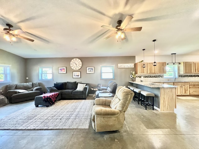 5781 S Waldron Rd, Pittsford, MI 49271 - living area featuring a ceiling fan and concrete flooring