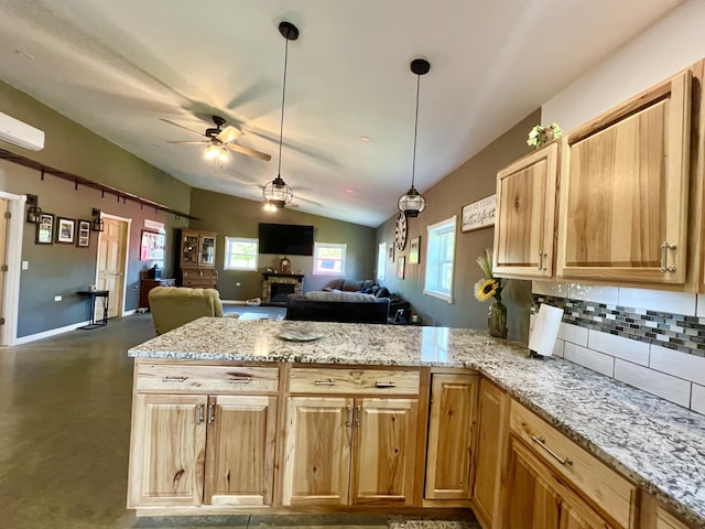 5781 S Waldron Rd, Pittsford, MI 49271 - kitchen with a peninsula, lofted ceiling, ceiling fan, decorative backsplash, and open floor plan