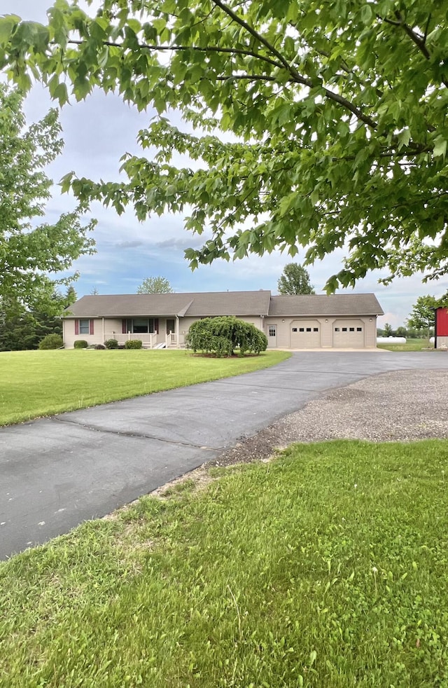 5781 S Waldron Rd, Pittsford, MI 49271 - ranch-style home with a front yard and a detached garage