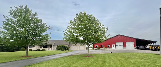 5781 S Waldron Rd, Pittsford, MI 49271 - ranch-style home with a front lawn and a garage