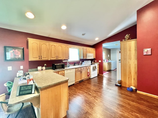 5781 S Waldron Rd, Pittsford, MI 49271 - kitchen with white appliances, light brown cabinetry, light countertops, vaulted ceiling, and dark wood-style floors