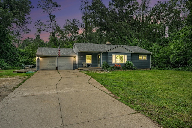 4319 Beckley Rd, Battle Creek, MI 49015 - ranch-style house featuring an attached garage, a front lawn, driveway, and a chimney