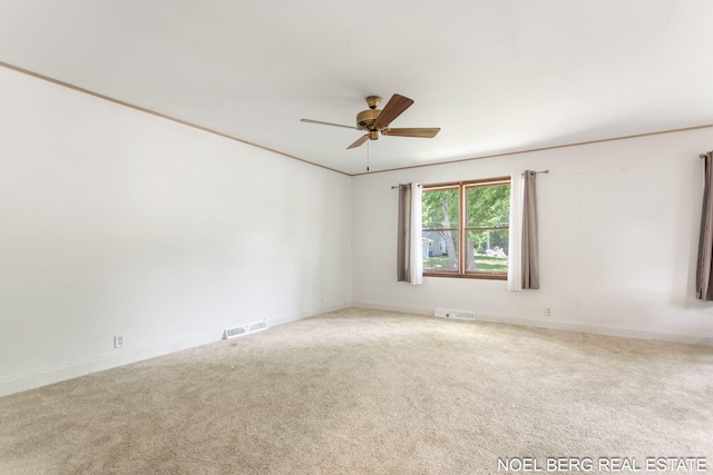 1710 Dykhouse Ave, Grand Haven, MI 49417 - unfurnished room with carpet floors, ceiling fan, and baseboards
