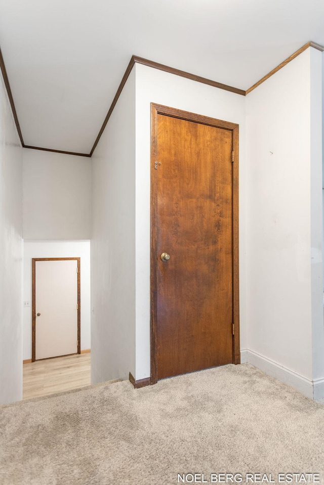 1710 Dykhouse Ave, Grand Haven, MI 49417 - unfurnished room featuring light colored carpet, crown molding, and baseboards