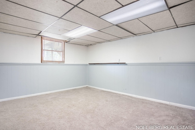 1710 Dykhouse Ave, Grand Haven, MI 49417 - below grade area with carpet floors, a paneled ceiling, baseboards, and wainscoting