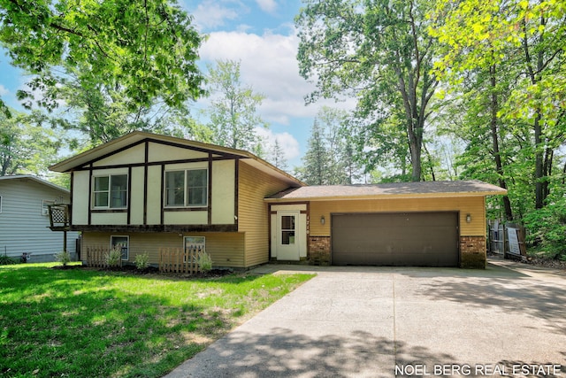 1710 Dykhouse Ave, Grand Haven, MI 49417 - tri-level home featuring brick siding, a garage, concrete driveway, and a front yard