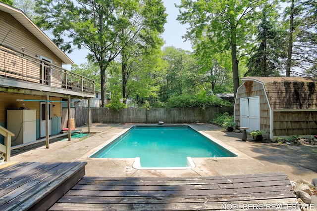 1710 Dykhouse Ave, Grand Haven, MI 49417 - view of swimming pool with a wooden deck, a fenced backyard, and a patio