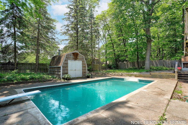 1710 Dykhouse Ave, Grand Haven, MI 49417 - view of swimming pool with a fenced backyard and a diving board