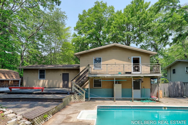 1710 Dykhouse Ave, Grand Haven, MI 49417 - rear view of house with a deck, stairs, a patio, and a balcony