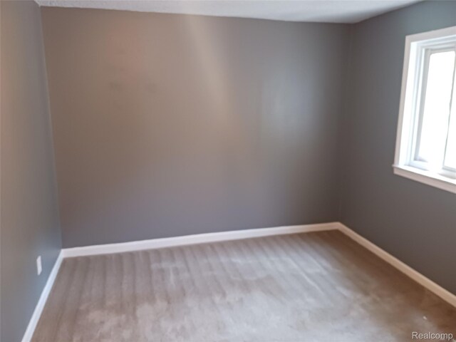 11132 Cape Cod St, Taylor, MI 48180 - carpeted empty room with baseboards