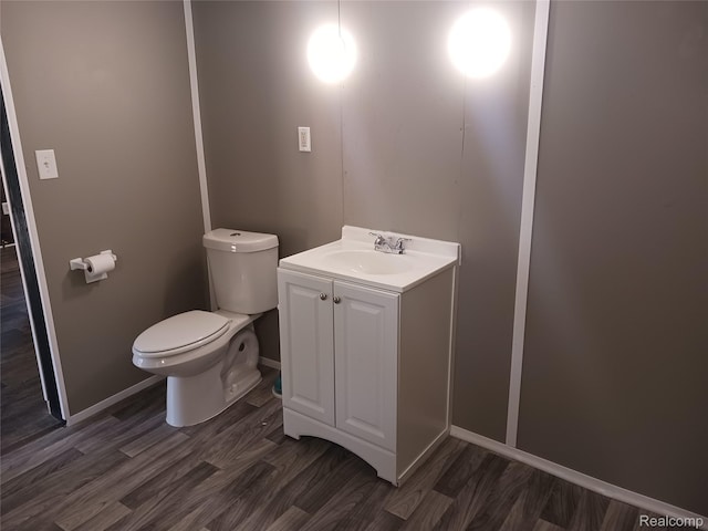 11132 Cape Cod St, Taylor, MI 48180 - half bathroom with toilet, vanity, wood finished floors, and baseboards