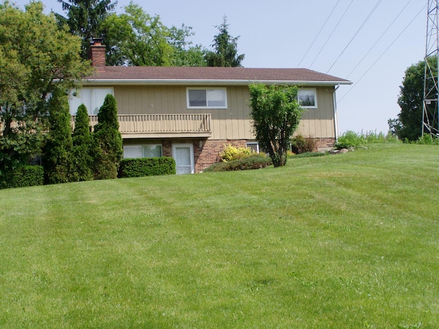 1358 Arroyo Dr, Ypsilanti, MI 48197 - view of front of property featuring a chimney and a front yard