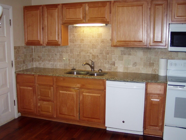 1358 Arroyo Dr, Ypsilanti, MI 48197 - kitchen featuring white appliances, a sink, stone countertops, and dark wood finished floors