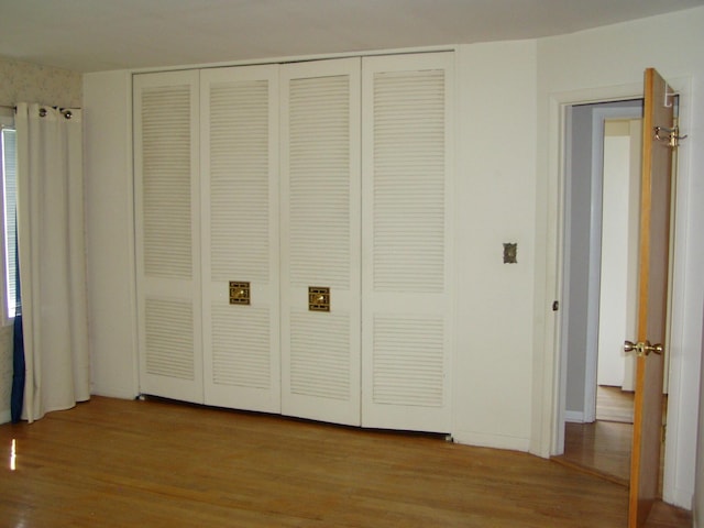 1358 Arroyo Dr, Ypsilanti, MI 48197 - unfurnished bedroom featuring wood finished floors and a closet