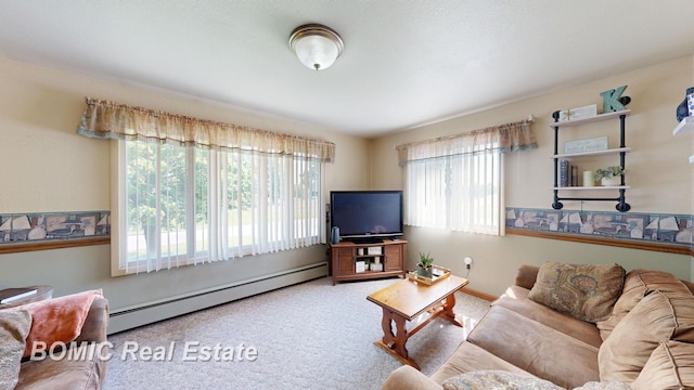 5612 Jay Rd, Vassar, MI 48768 - living area featuring a baseboard heating unit, plenty of natural light, carpet floors, and baseboards