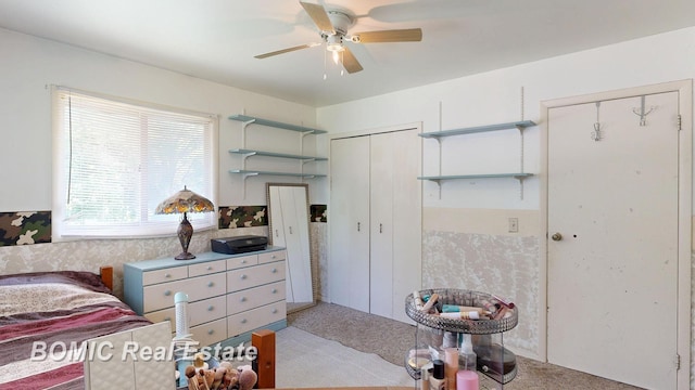 5612 Jay Rd, Vassar, MI 48768 - bedroom featuring multiple closets, light colored carpet, and ceiling fan