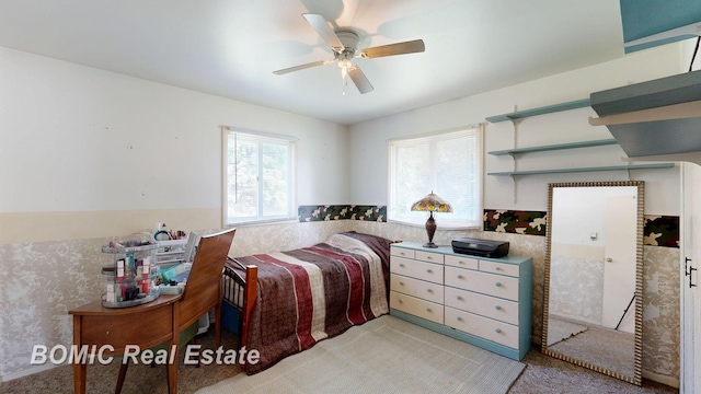 5612 Jay Rd, Vassar, MI 48768 - bedroom featuring wainscoting, light carpet, and ceiling fan