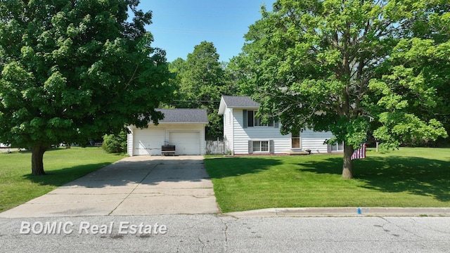 5612 Jay Rd, Vassar, MI 48768 - view of front facade featuring an outbuilding, a garage, and a front lawn