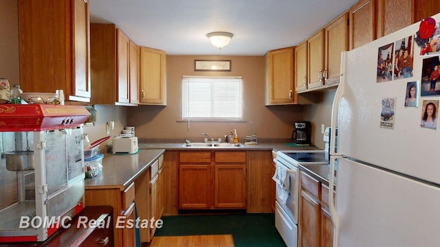 2081 Skiles Dr, Saint Helen, MI 48656 - kitchen with white appliances, a sink, and brown cabinetry