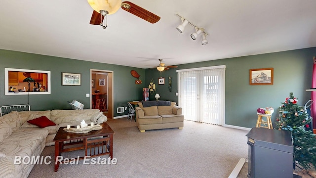 2081 Skiles Dr, Saint Helen, MI 48656 - living room with a ceiling fan, carpet flooring, and baseboards