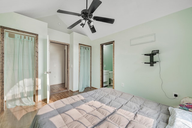 22251 210th Ave, Tustin, MI 49688 - bedroom featuring wood finished floors, lofted ceiling, a ceiling fan, and ensuite bathroom