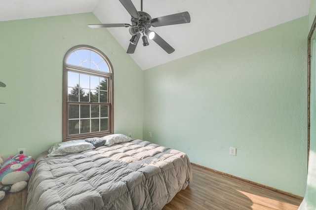 22251 210th Ave, Tustin, MI 49688 - bedroom with lofted ceiling, wood finished floors, and ceiling fan