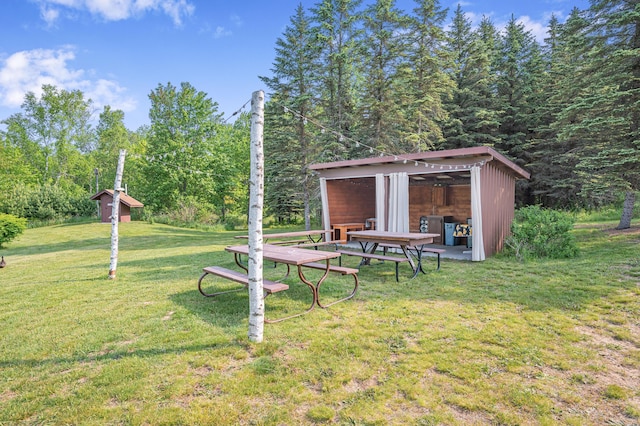 22251 210th Ave, Tustin, MI 49688 - view of green lawn with an outbuilding
