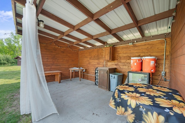 22251 210th Ave, Tustin, MI 49688 - bedroom with wooden walls and carpet floors