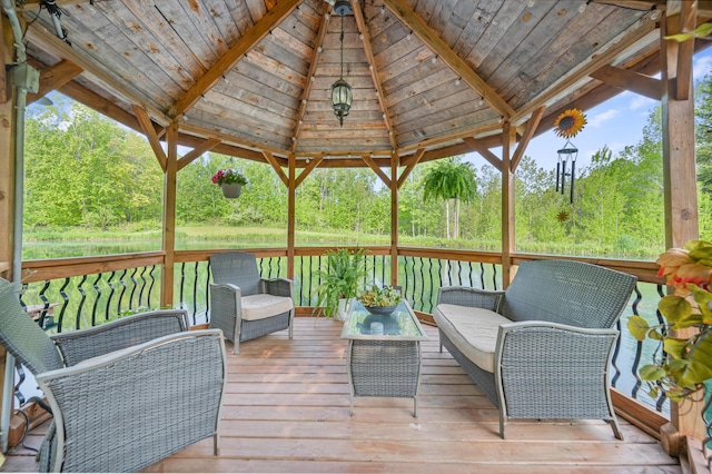 22251 210th Ave, Tustin, MI 49688 - deck featuring an outdoor living space, view of wooded area, and a gazebo