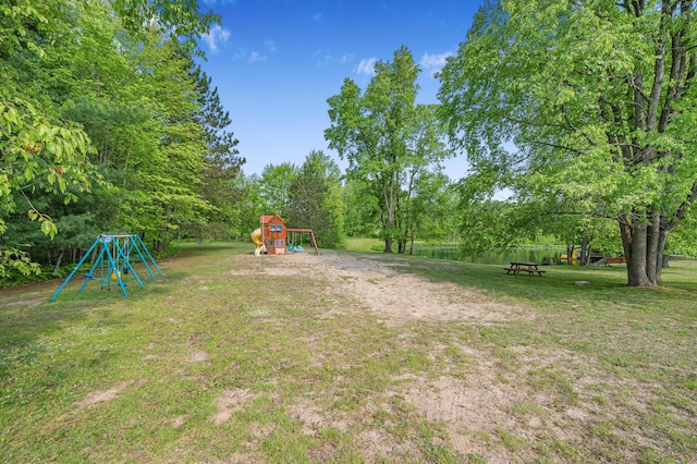 22251 210th Ave, Tustin, MI 49688 - view of green lawn featuring a playground