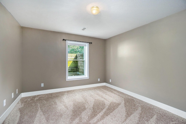 171 Arnold St, Allegan, MI 49010 - spare room featuring carpet flooring and baseboards