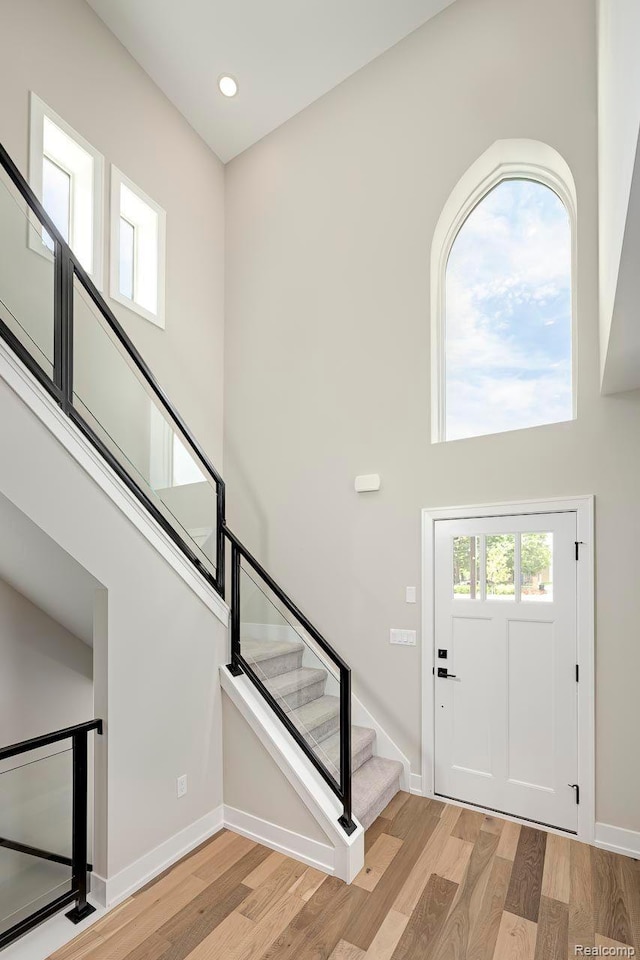 3634 Trumbull St Unit 65, Detroit, MI 48208 - foyer entrance with stairway, light wood-type flooring, baseboards, and recessed lighting