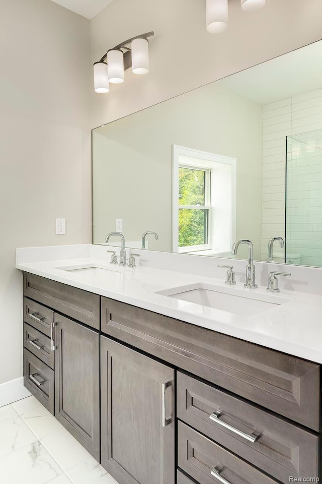3634 Trumbull St Unit 65, Detroit, MI 48208 - bathroom with double vanity and marble finish flooring