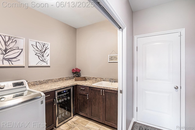 17769 Tiger Dr, Macomb, MI 48042 - laundry area featuring washer / clothes dryer, beverage cooler, cabinet space, and bar