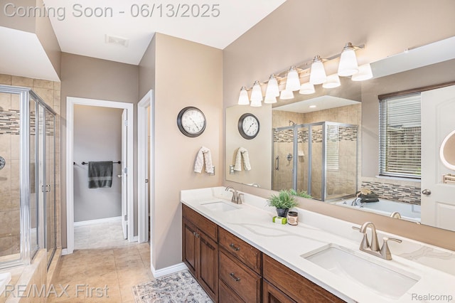 17769 Tiger Dr, Macomb, MI 48042 - bathroom with a stall shower, double vanity, a garden tub, and tile patterned flooring