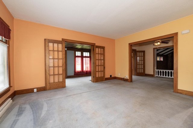 3804 Portage St, Kalamazoo, MI 49001 - carpeted spare room with french doors, baseboard heating, and ceiling fan