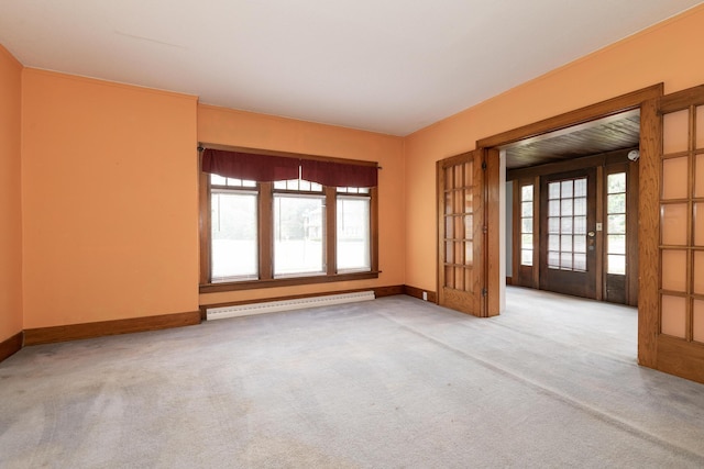 3804 Portage St, Kalamazoo, MI 49001 - spare room featuring baseboard heating, plenty of natural light, and carpet