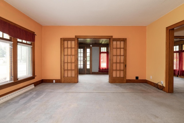3804 Portage St, Kalamazoo, MI 49001 - spare room with a baseboard radiator, french doors, and carpet flooring